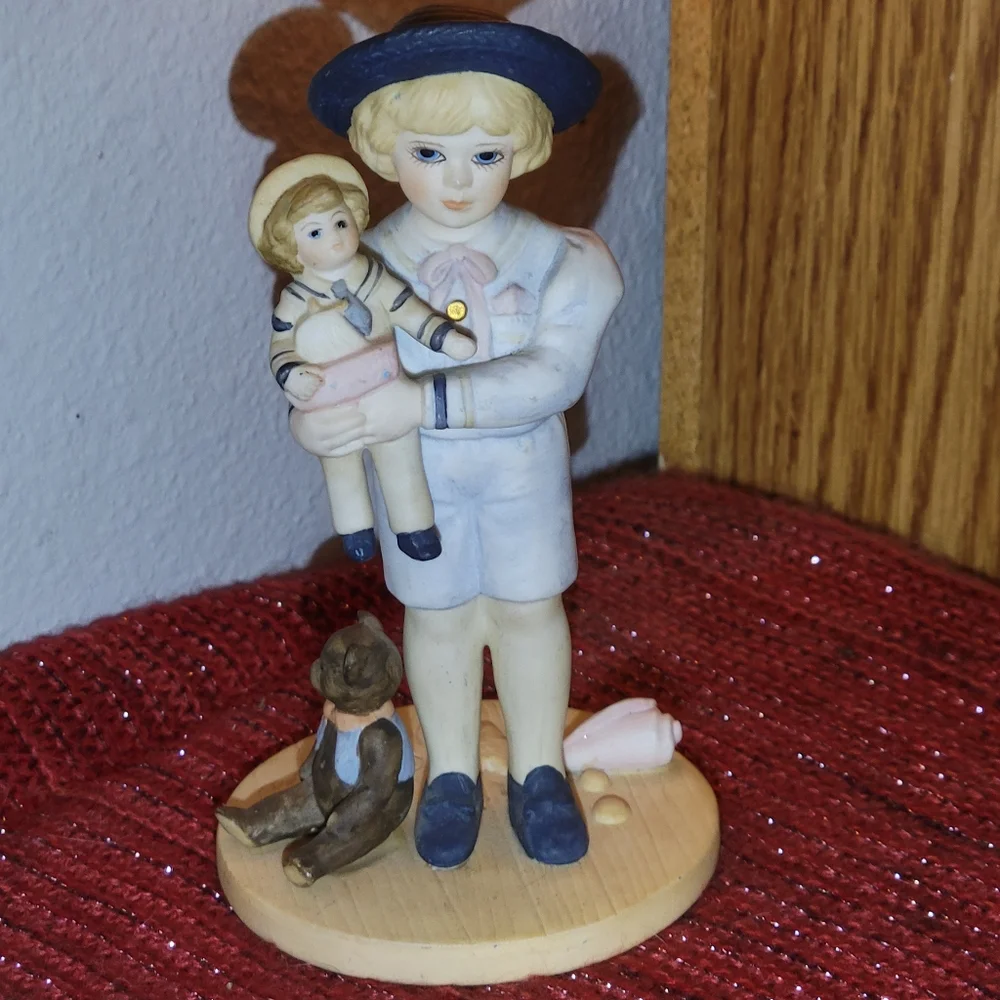 VINTAGE PORCELAIN BOY WITH DOLL FIGURINE 